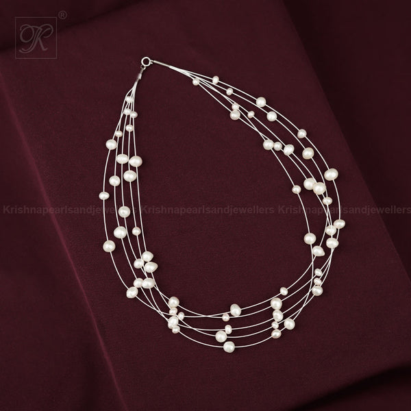 Whispers of Pearl: Floating White Pearl | Krishna Pearls and Jewellers