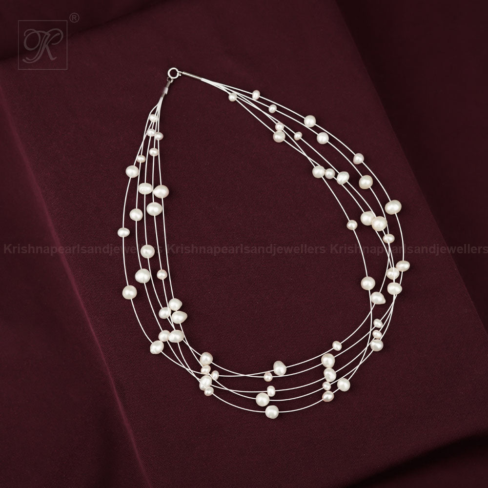 Whispers of Pearl: Floating White Pearl | Krishna Pearls and Jewellers