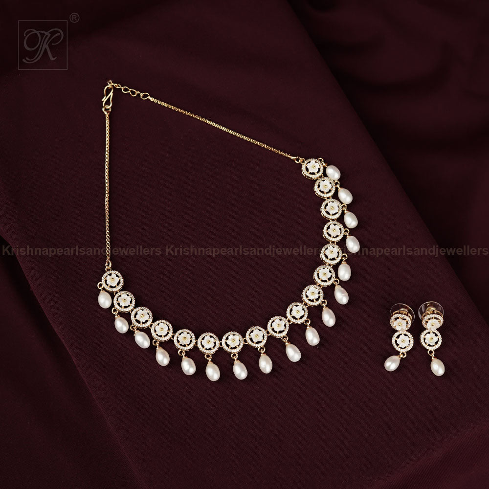 Delicate Crystal Bloom & Pearl Drop Jewelry | Krishna Pearls and Jewellers