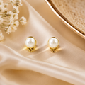 Elegant Pearl Stud Earrings with Gold-Tone Floral Detail - Krishna Pearls and Jewellers