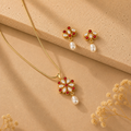 Pinnacle Freshwater Pearl with Red Stone Earrings & Pendant Set in Gold | Pearl Jewellery Set | Krishna Pearls & Jewellers