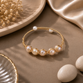 Handcrafted Gold-Tone Pearl Wire Wrap Bracelet | Adjustable Freshwa... — view 1 — pearl jewellery — Krishna Pearls Hyderabad